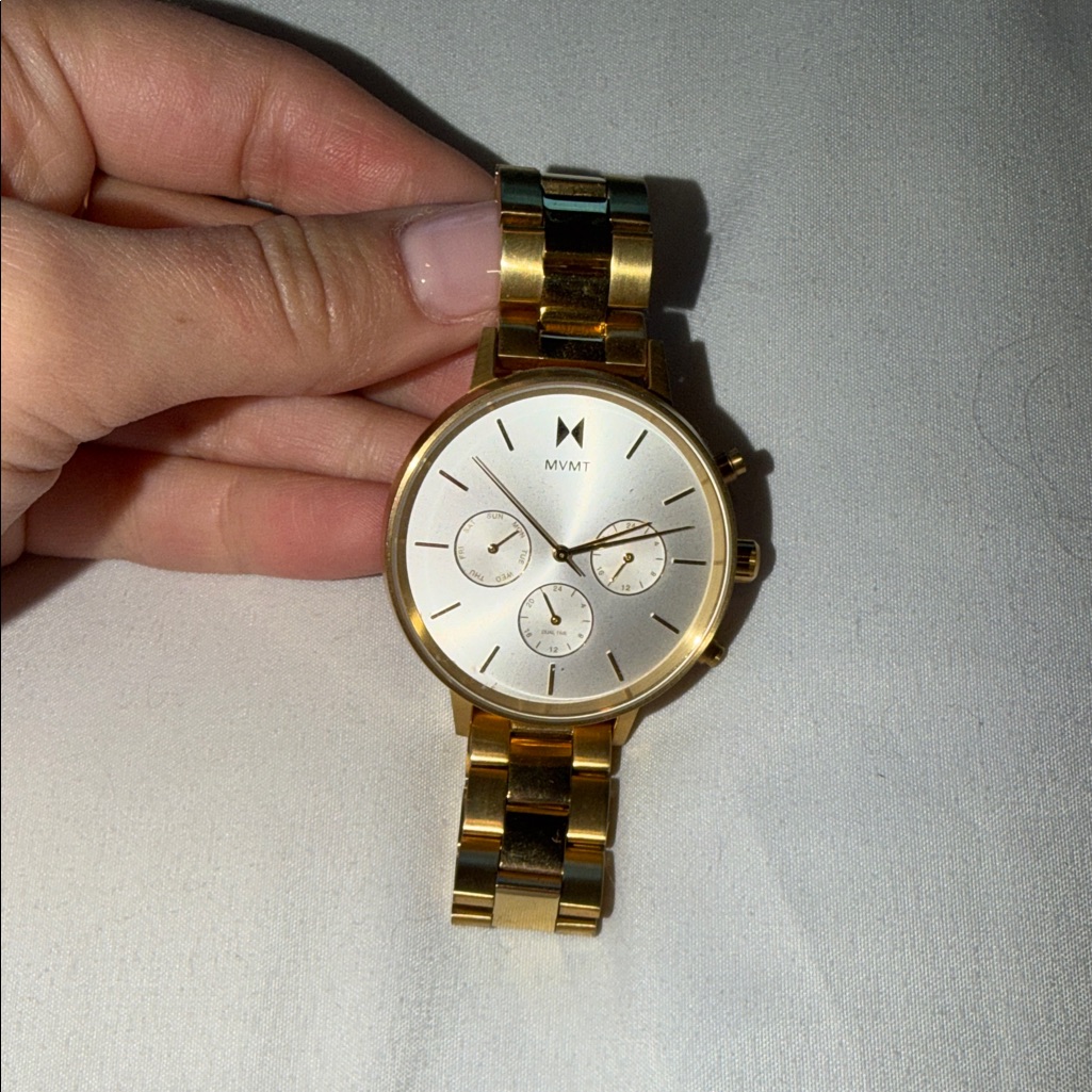 Mvmt Gold Timepiece With White Face
